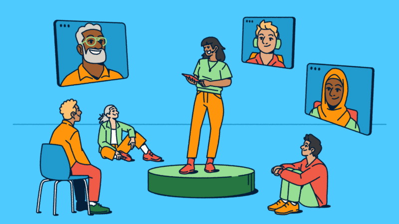 Illustration showing a hybrid meeting in action: a person presents from a circular stage while some attendees sit nearby in-person and others join remotely through video screens. The diverse group highlights how today's conferences blend virtual and in-person experiences to connect everyone regardless of location.