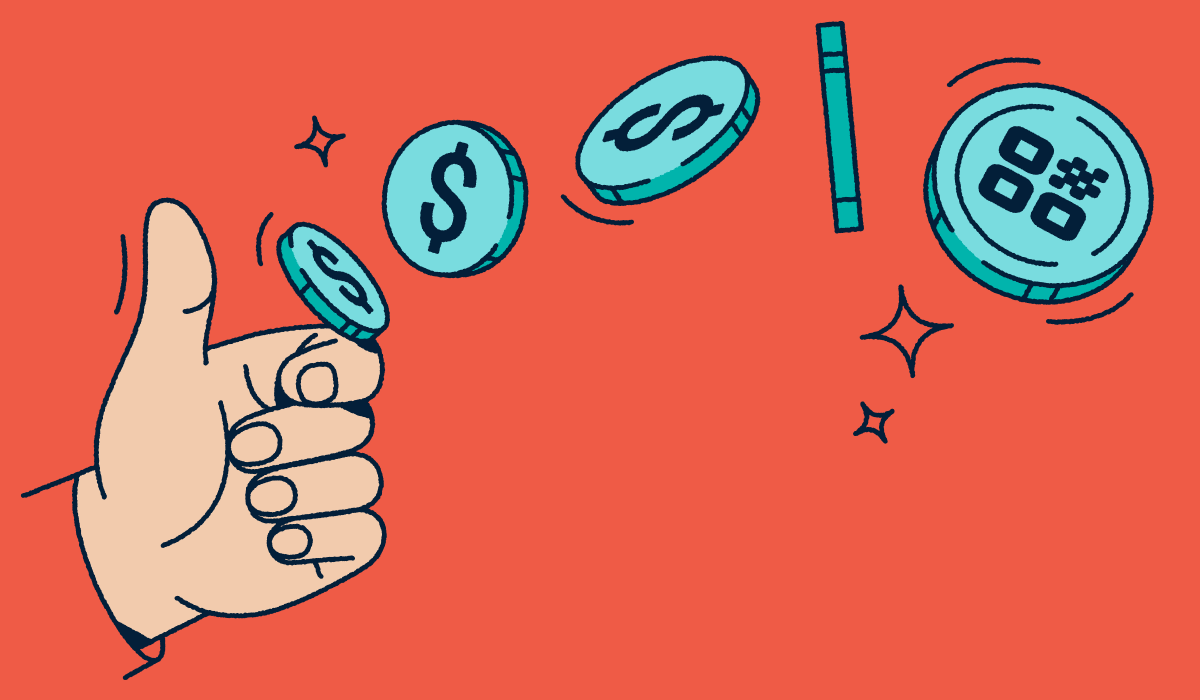 A hand flipping a coin with a QR Code on it.